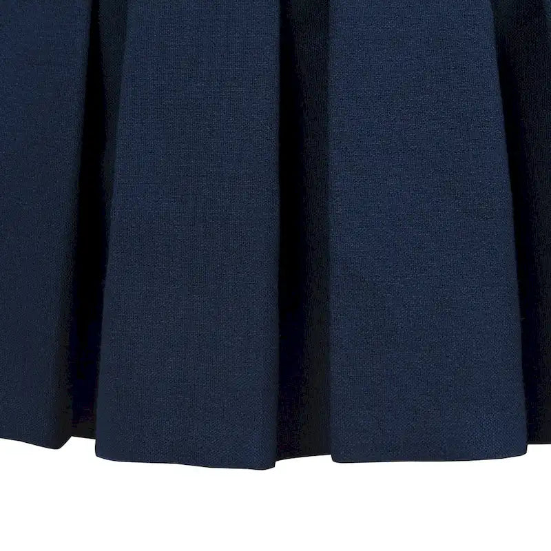 Pouf de cocktail rond capitonné avec jupe plissée, bleu nuit